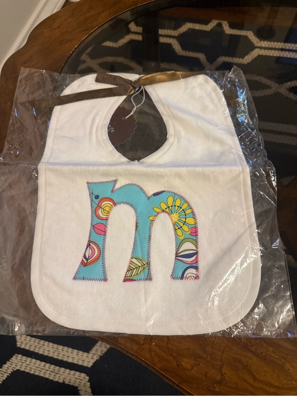 Hinge White Bib with Blue Floral 'm' Applique